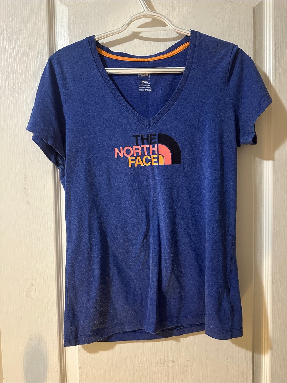 The North Face Women's V-Neck Logo Tee in Blue with Pink and Orange Accents